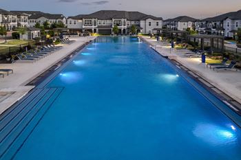 resort-inspired swimming pool at Reveal on the Lake apartments